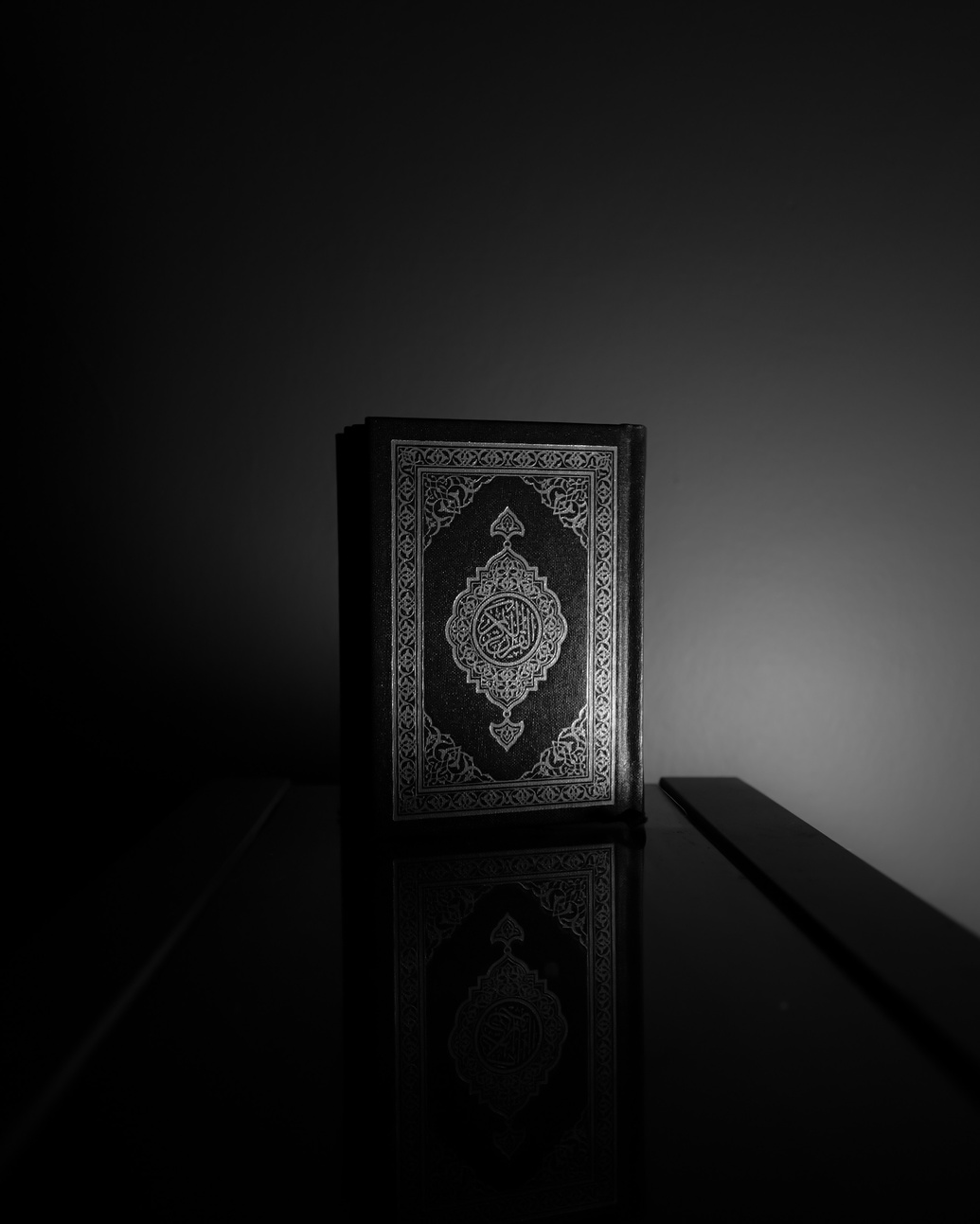 Grayscale Photo of a Quran